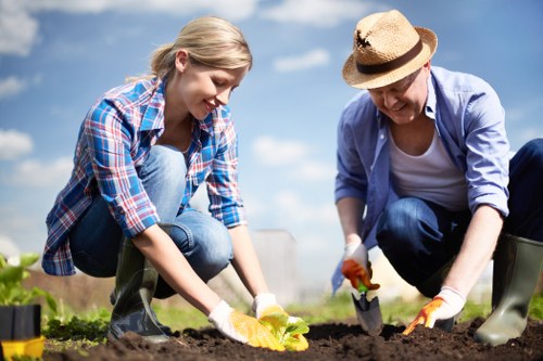 Gardening team preparing for garden clearance with man and van